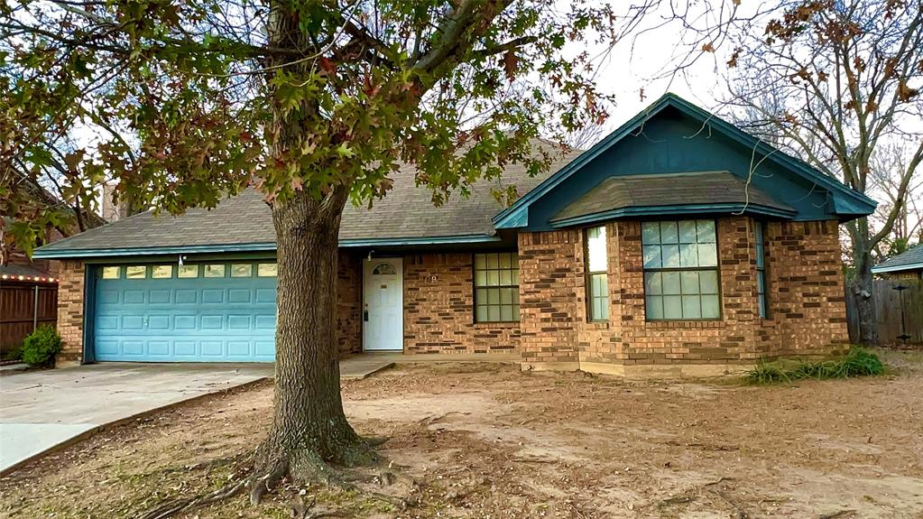 609 Main Street Roanoke, TX 76262 - Photo 1 of 1 a front view of a house with garden