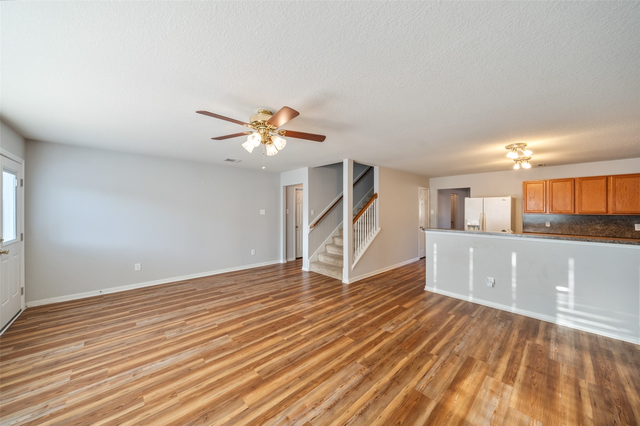 16820 Infield Court Conroe, TX 77385 - Photo 17 of 44 a view of an empty room with wooden floor and a window