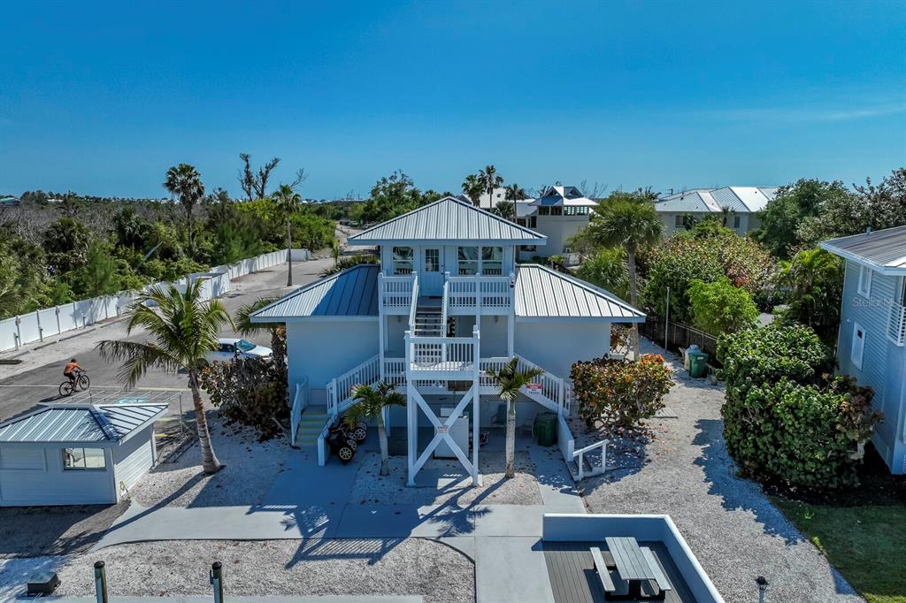 5820 Gasparilla Road, Unit SLIP 35 Boca Grande, FL 33921 - Photo 13 of 14 an aerial view of a house with a yard and balcony