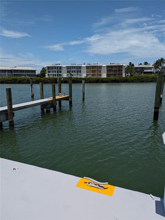 5820 Gasparilla Road, Unit SLIP 35 Boca Grande, FL 33921 - Photo 6 of 14 a view of swimming pool with outdoor seating and yard