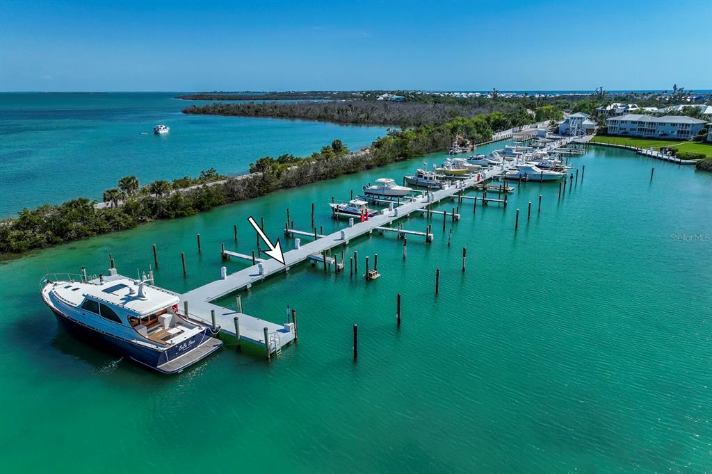 5820 Gasparilla Road, Unit SLIP 35 Boca Grande, FL 33921 - Photo 7 of 14 a view of a lake with a yard