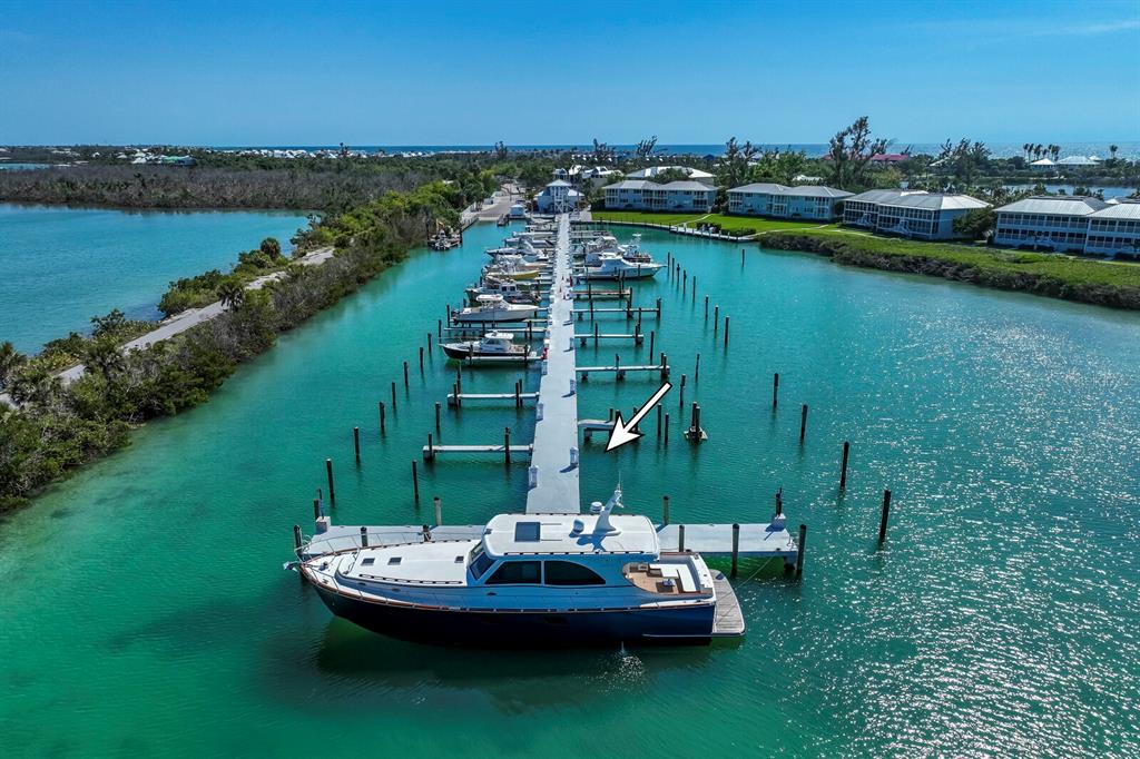 5820 Gasparilla Road, Unit SLIP 35 Boca Grande, FL 33921 - Photo 8 of 14 a view of a lake with a mountain in the background