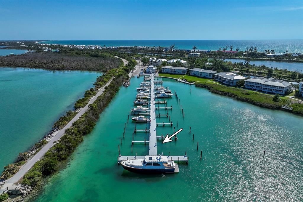 5820 Gasparilla Road, Unit SLIP 35 Boca Grande, FL 33921 - Photo 9 of 14 a view of a lake with a mountain