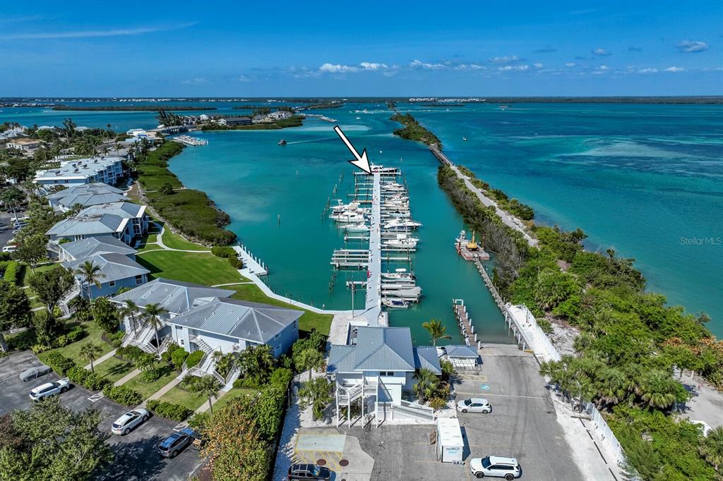 5820 Gasparilla Road, Unit SLIP 35 Boca Grande, FL 33921 - Photo 10 of 14 a view of a lake with a city