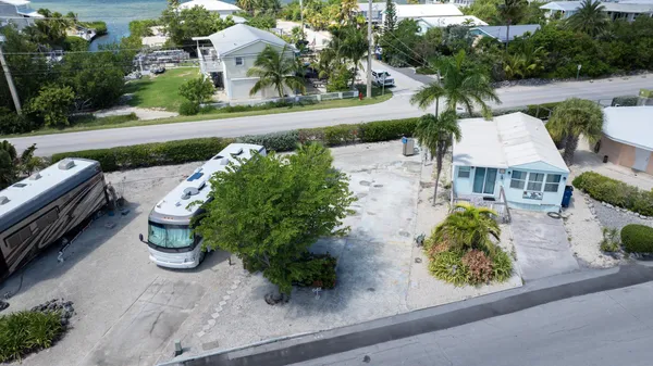 an aerial view of a house with outdoor space