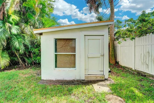 a front view of a house with yard patio and green space