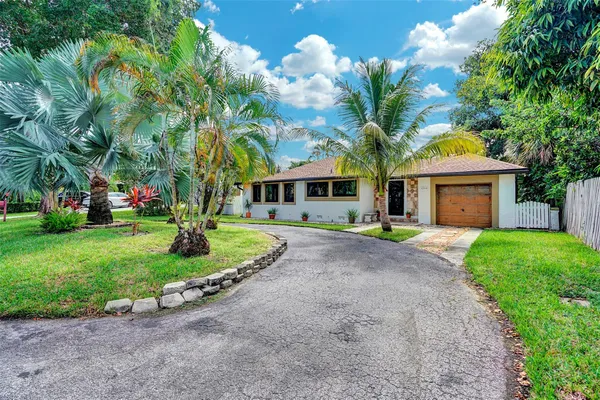 an aerial view of residential houses with city view