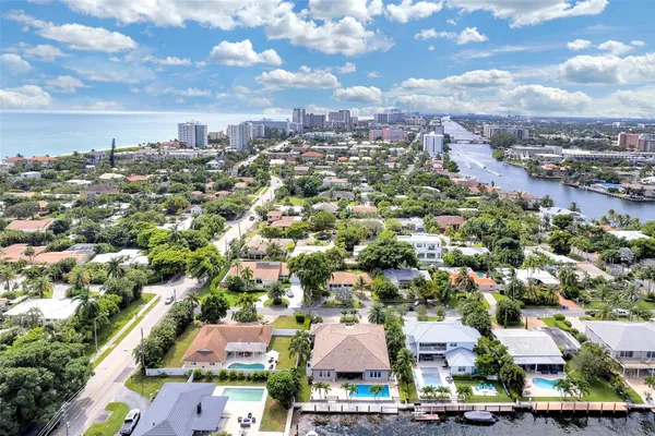 an aerial view of residential houses with outdoor space