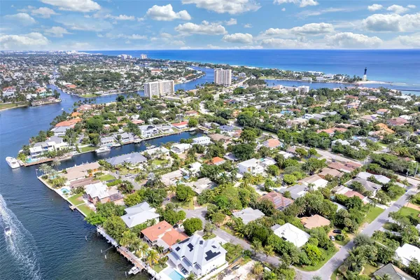 an aerial view of residential houses with outdoor space