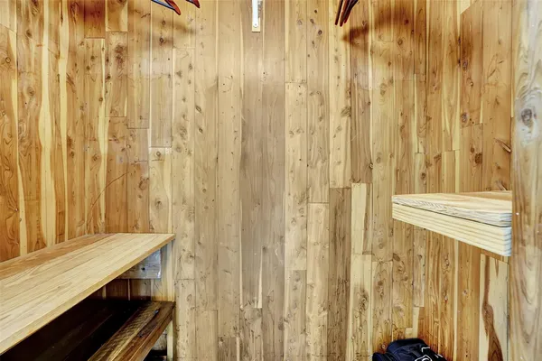 a bathroom with a granite countertop sink and a shower curtain