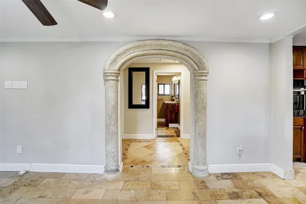 a kitchen with stainless steel appliances granite countertop a refrigerator a stove and a sink