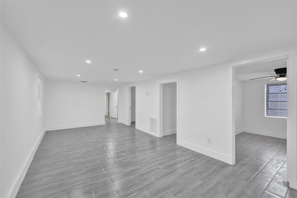 5025 Southwest 22nd Street Hollywood, FL 33023 - Photo 11 of 52 a view of an empty room with wooden floor