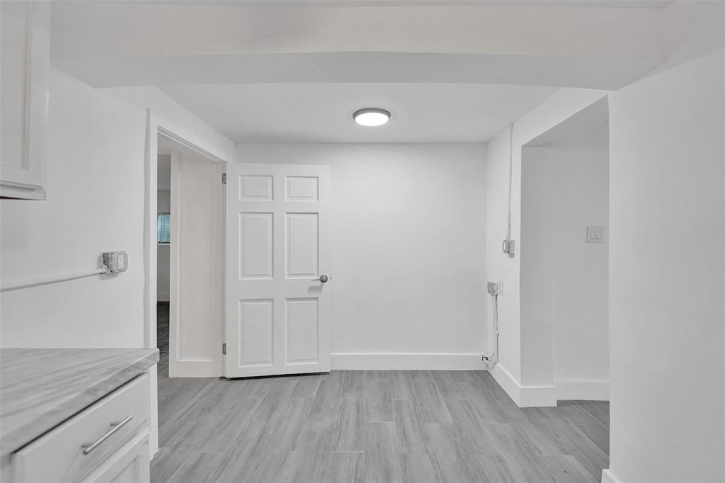5025 Southwest 22nd Street Hollywood, FL 33023 - Photo 23 of 52 a view of an empty room with closet and wooden floor