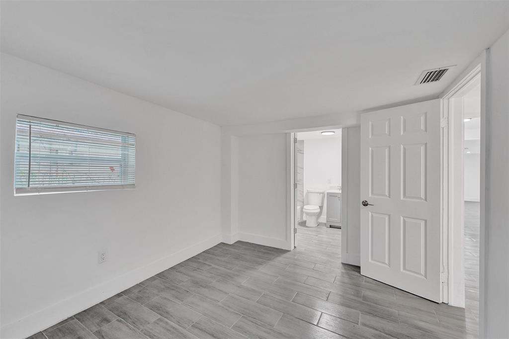 5025 Southwest 22nd Street Hollywood, FL 33023 - Photo 30 of 52 a view of an empty room with wooden floor