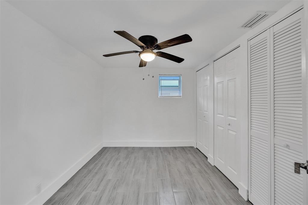 5025 Southwest 22nd Street Hollywood, FL 33023 - Photo 33 of 52 a view of room with hardwood floor and a ceiling fan