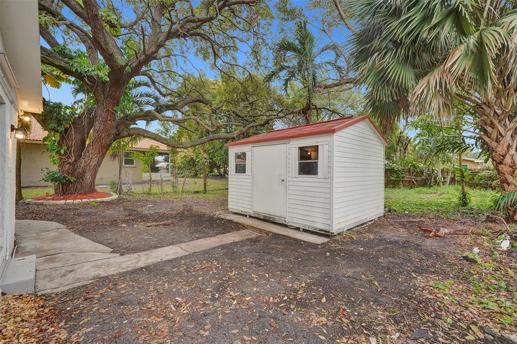 5025 Southwest 22nd Street Hollywood, FL 33023 - Photo 42 of 52 a view of a backyard with a tree