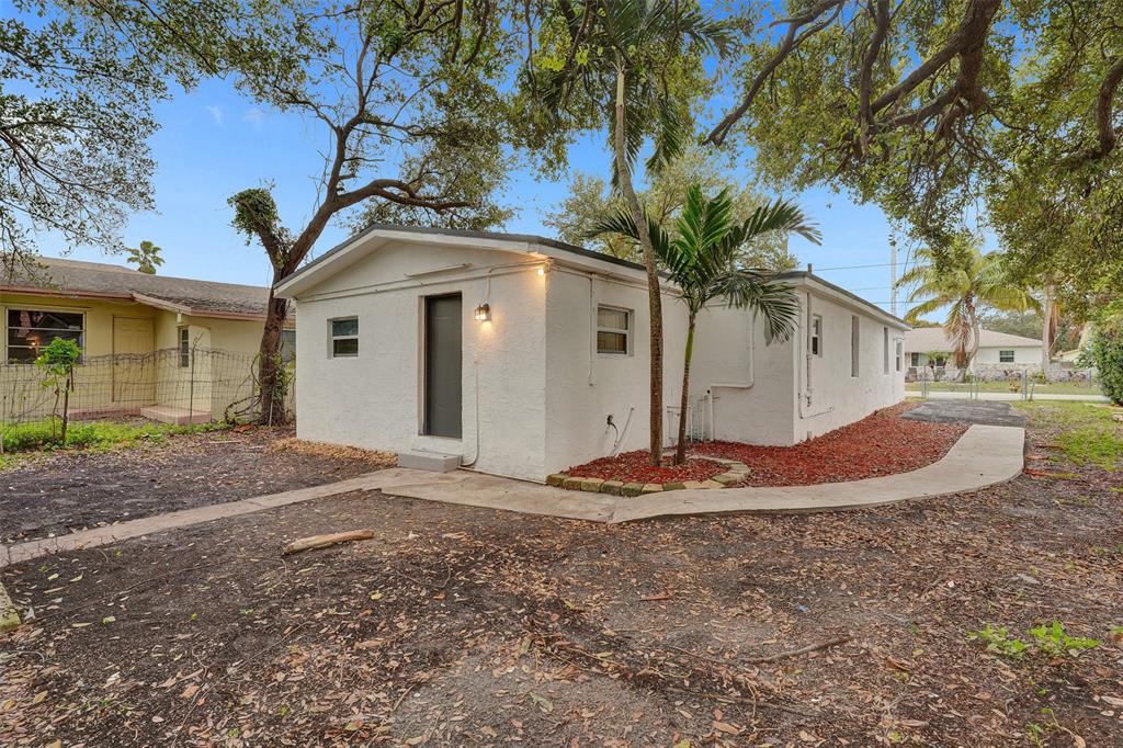 5025 Southwest 22nd Street Hollywood, FL 33023 - Photo 47 of 52 a front view of a house with a yard