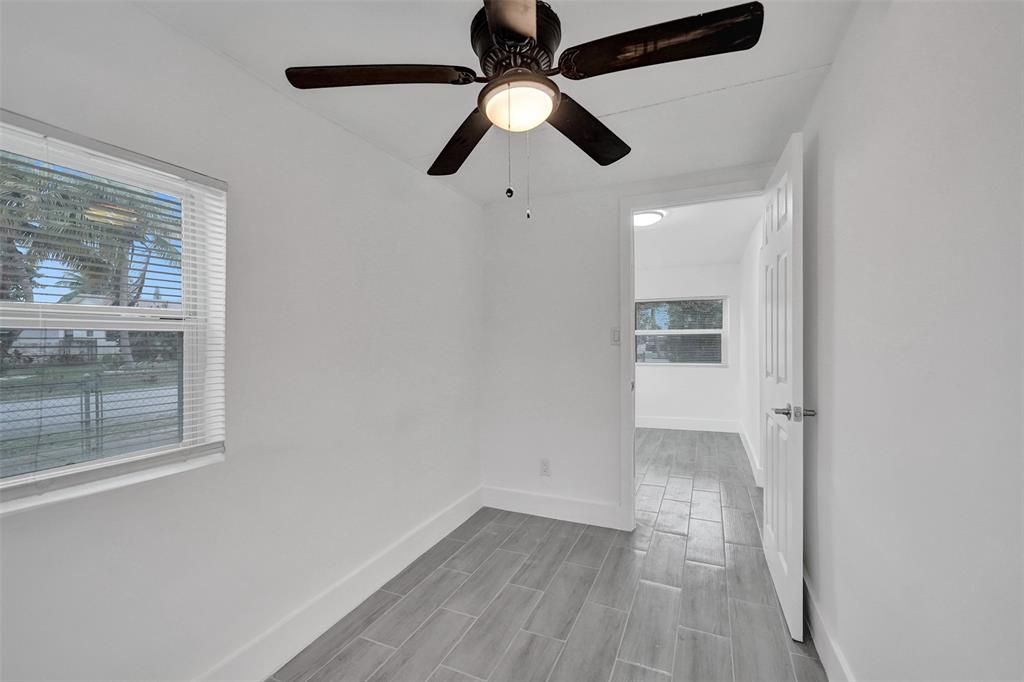 5025 Southwest 22nd Street Hollywood, FL 33023 - Photo 7 of 52 wooden floor in an empty room with a window