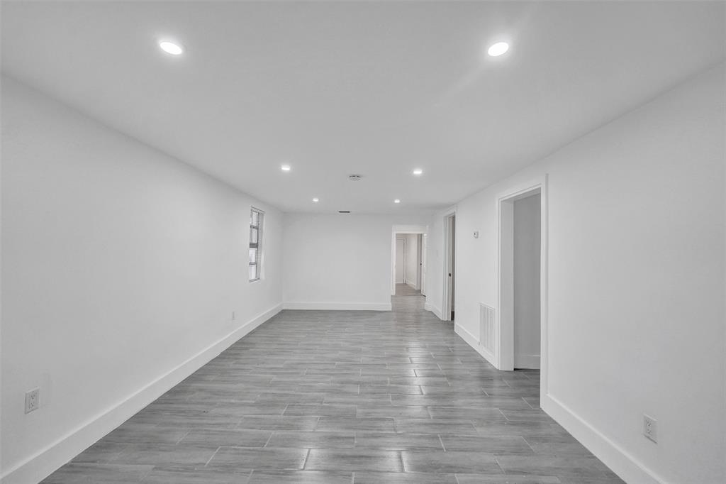 5025 Southwest 22nd Street Hollywood, FL 33023 - Photo 10 of 52 a view of an empty room with wooden floor