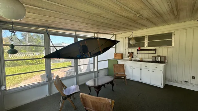 a kitchen with table and chairs