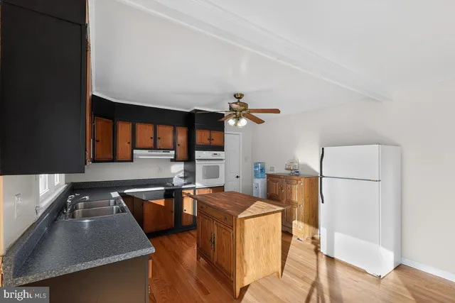 a bedroom with furniture and wooden floor