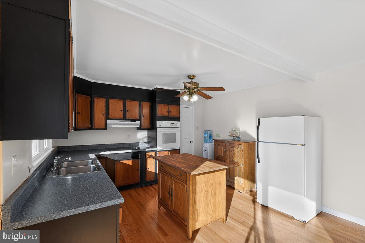 224 Blake Road Elkton, MD 21921 - Photo 15 of 55 a kitchen with a sink appliances and cabinets