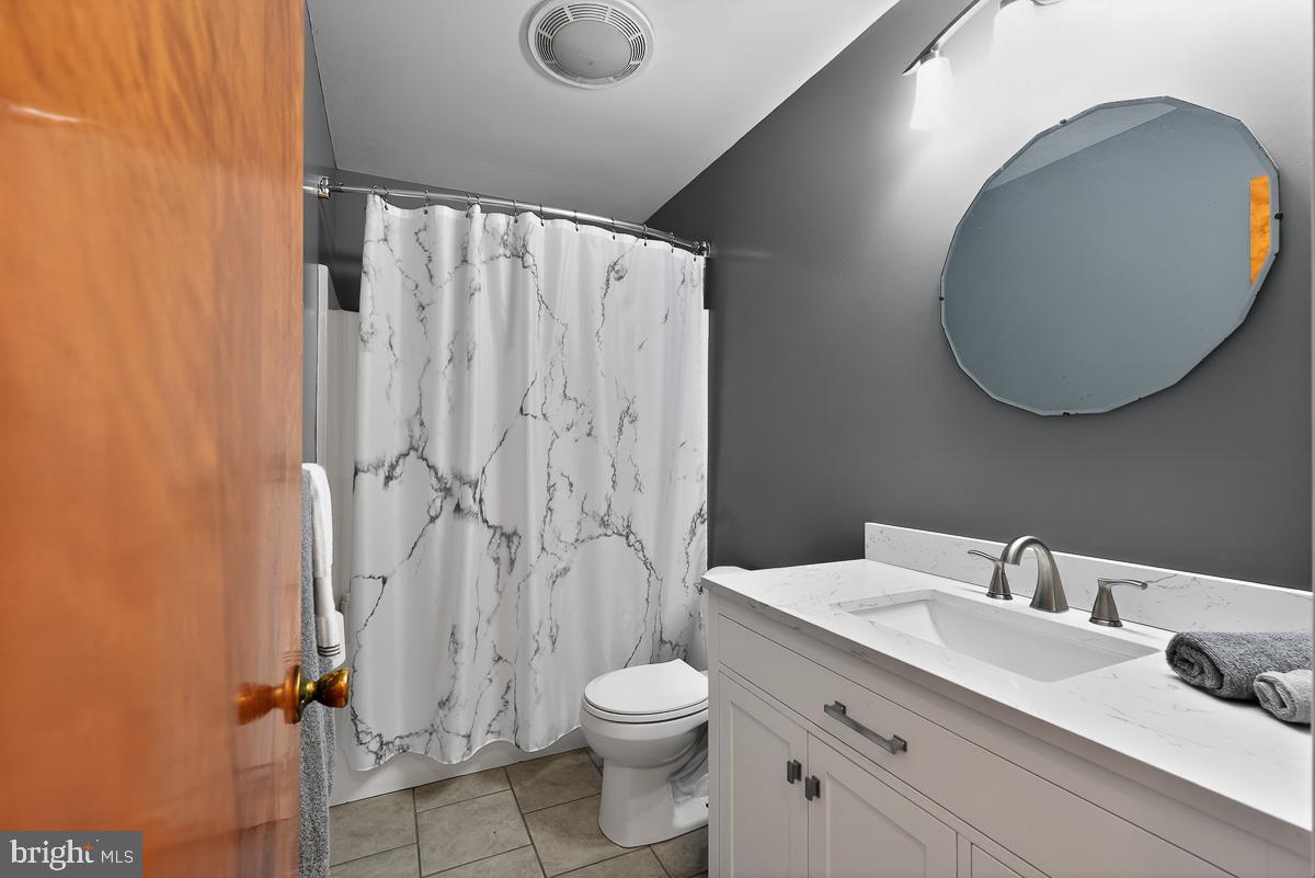 224 Blake Road Elkton, MD 21921 - Photo 22 of 55 a bathroom with a toilet a sink and garden