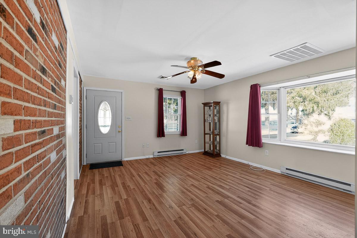 224 Blake Road Elkton, MD 21921 - Photo 25 of 55 a view of an empty room with a window and wooden floor