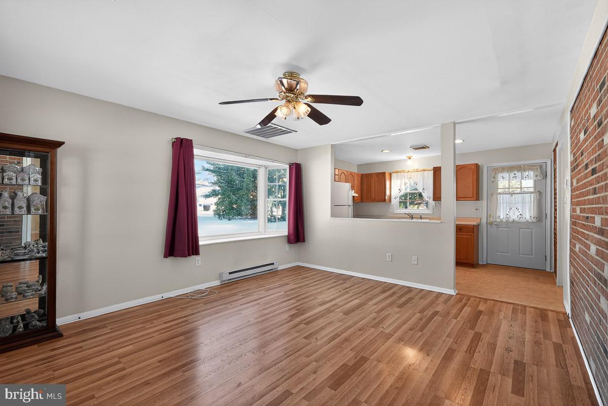 224 Blake Road Elkton, MD 21921 - Photo 27 of 55 a view of a big room with wooden floor windows and cabinet
