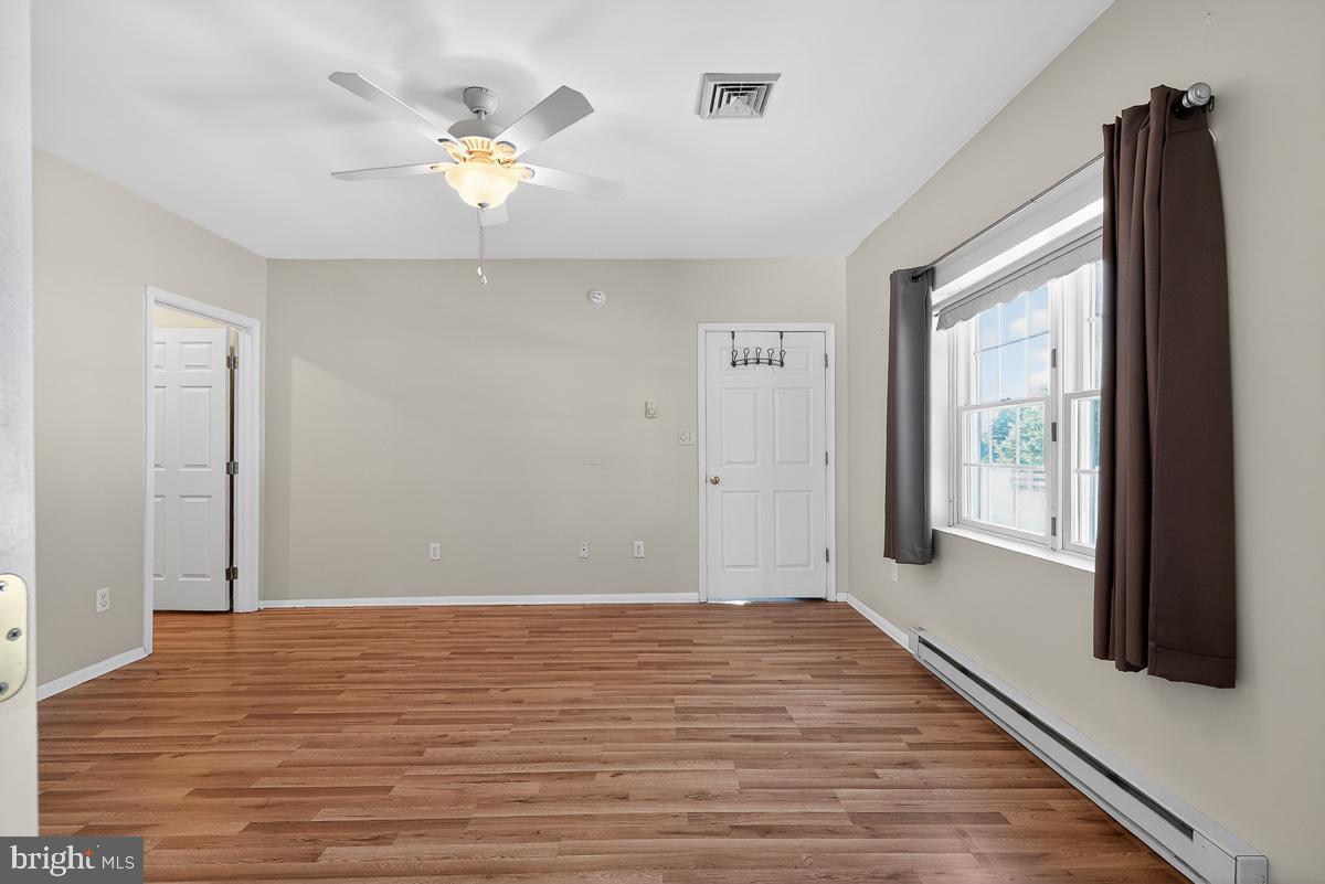 224 Blake Road Elkton, MD 21921 - Photo 32 of 55 a view of an empty room with wooden floor and a window
