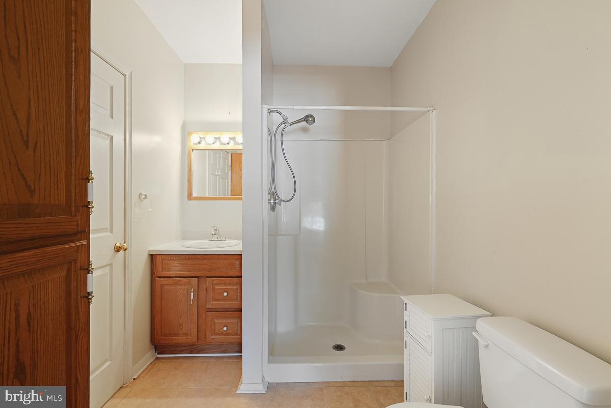 224 Blake Road Elkton, MD 21921 - Photo 34 of 55 a bathroom with a shower a toilet and sink