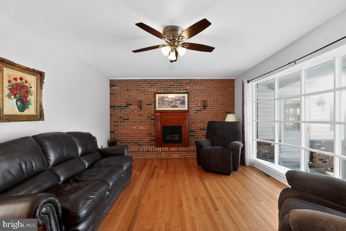 224 Blake Road Elkton, MD 21921 - Photo 8 of 55 a living room with furniture and a fireplace