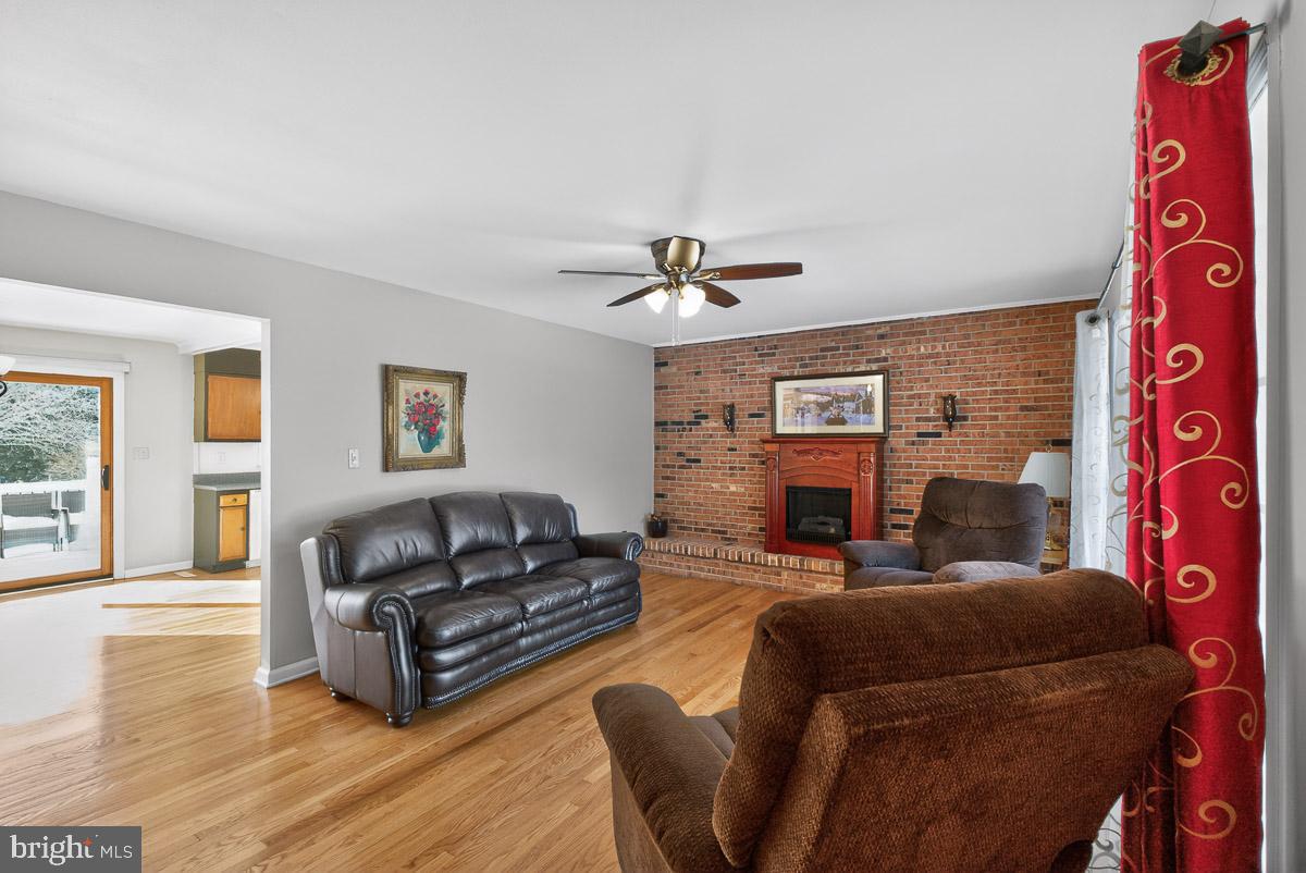 224 Blake Road Elkton, MD 21921 - Photo 9 of 55 a living room with furniture and a fireplace