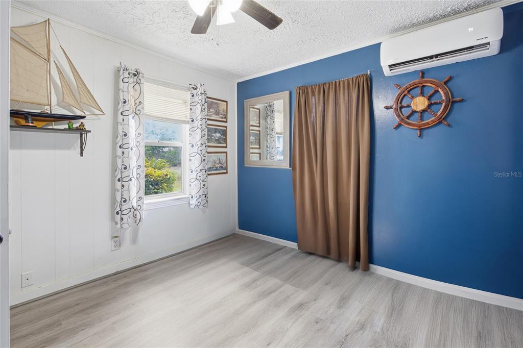 5403 East Tangelo Lane Inverness, FL 34453 - Photo 14 of 32 an empty room with windows and closet