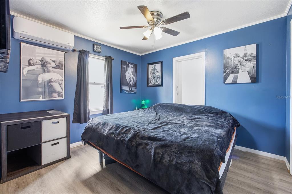 5403 East Tangelo Lane Inverness, FL 34453 - Photo 17 of 32 a bedroom with a bed and a dresser