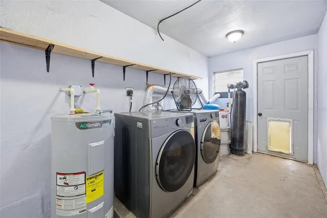 a utility room with dryer and washer