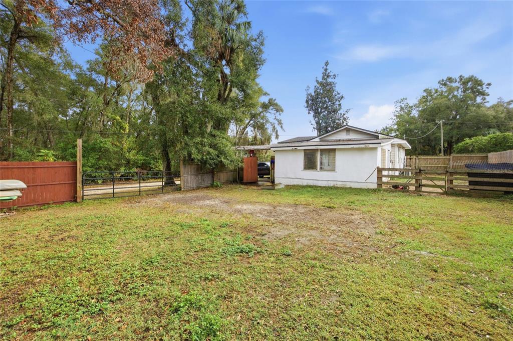 5403 East Tangelo Lane Inverness, FL 34453 - Photo 23 of 32 a front view of a house with a yard