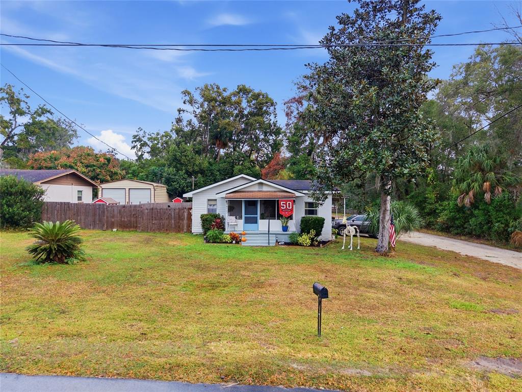 5403 East Tangelo Lane Inverness, FL 34453 - Photo 24 of 32 a front view of a house with a yard