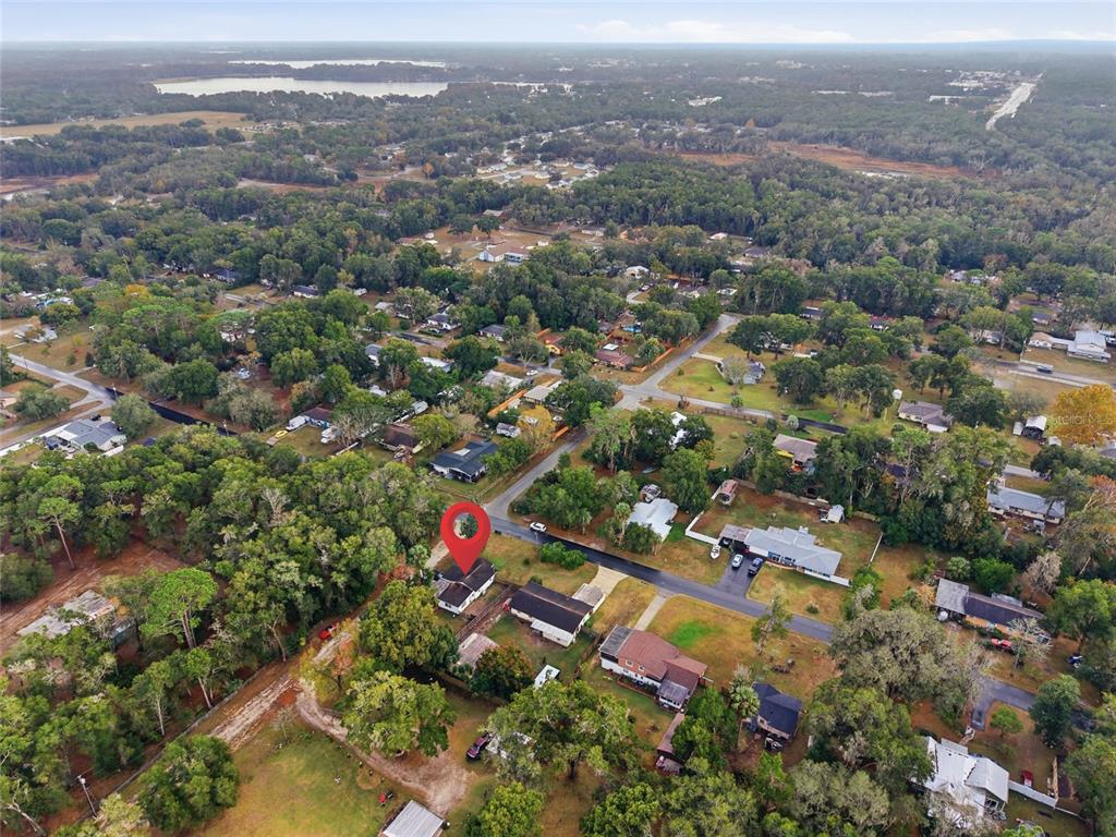 5403 East Tangelo Lane Inverness, FL 34453 - Photo 31 of 32 an aerial view of residential houses with outdoor space and trees