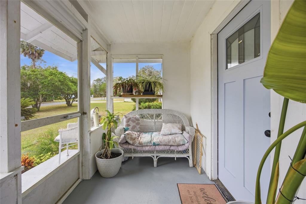 5403 East Tangelo Lane Inverness, FL 34453 - Photo 5 of 32 a living room with furniture and a floor to ceiling window
