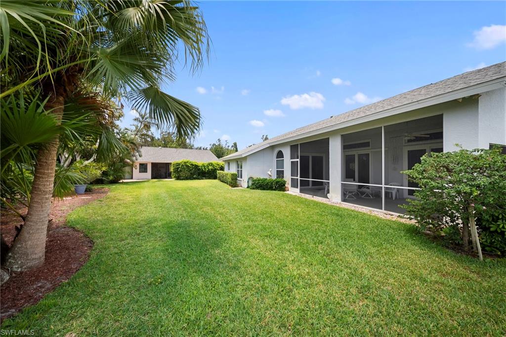 3971 Spring Garden Lane Estero, FL 33928 - Photo 25 of 31 a front view of house with yard and green space