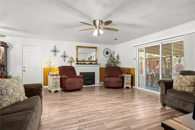 a bedroom with furniture and a large window