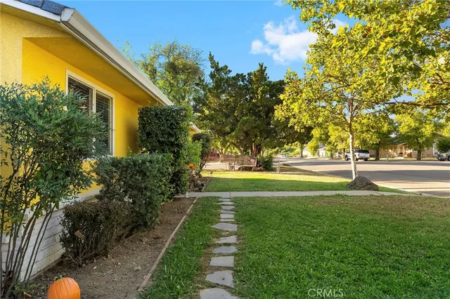 a view of pool of the house with green space