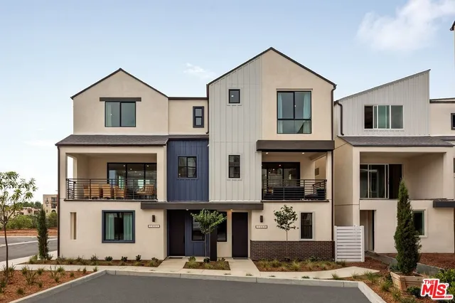 a front view of a house with a garage