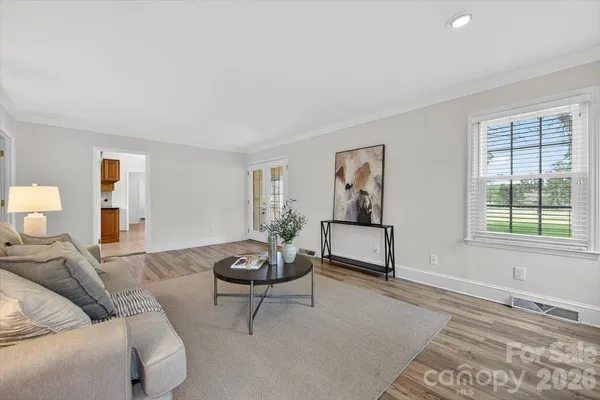 a living room with furniture and window