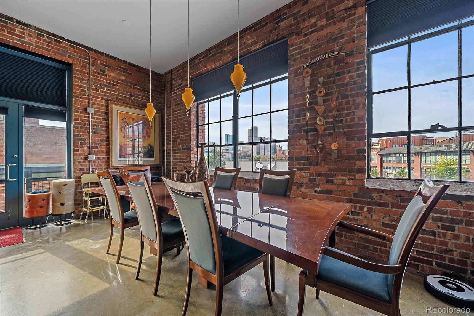 2500 Walnut Street, Unit 202 Denver, CO 80205 - Photo 14 of 31 a view of a dining room with furniture window and outside view