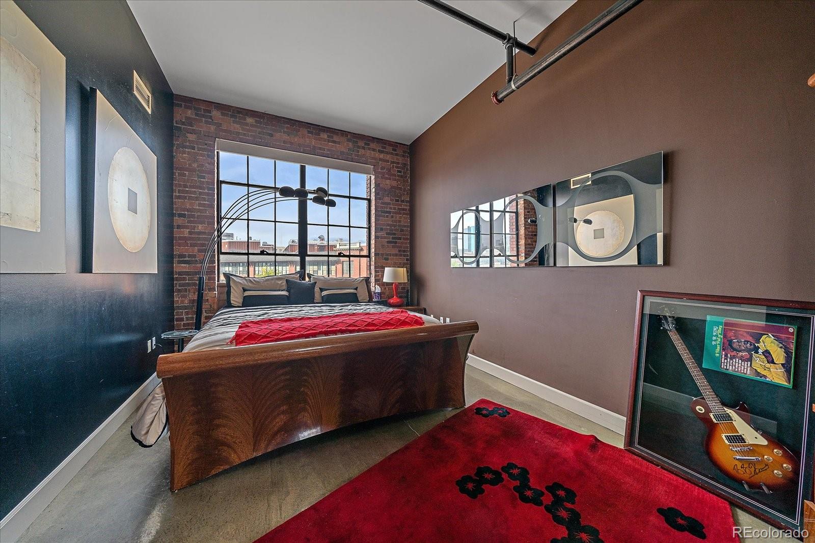 2500 Walnut Street, Unit 202 Denver, CO 80205 - Photo 17 of 31 a living room with baby bed furniture and a window