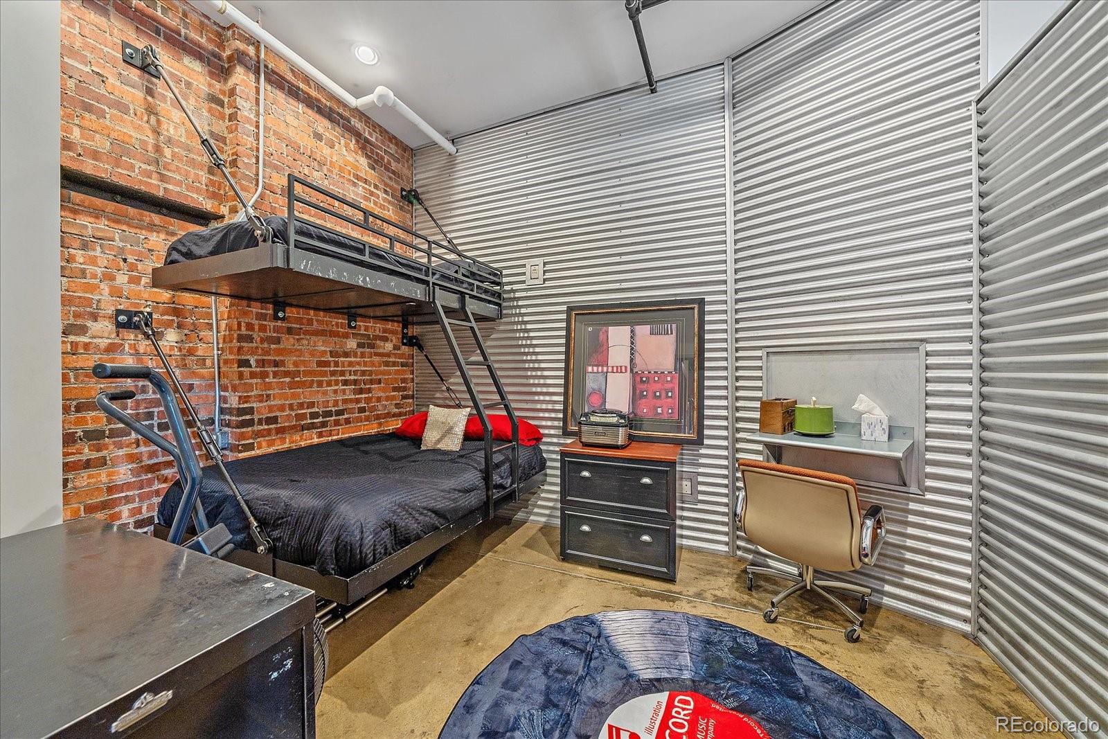 2500 Walnut Street, Unit 202 Denver, CO 80205 - Photo 23 of 31 a bedroom with furniture and a window