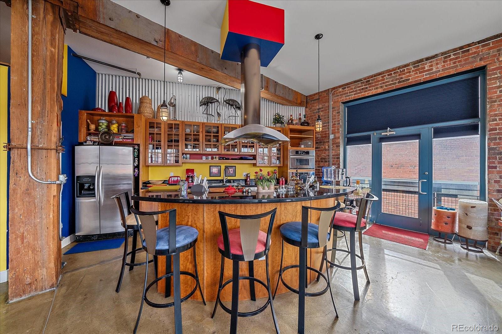 2500 Walnut Street, Unit 202 Denver, CO 80205 - Photo 10 of 31 a dining room filled with furniture and wooden floor
