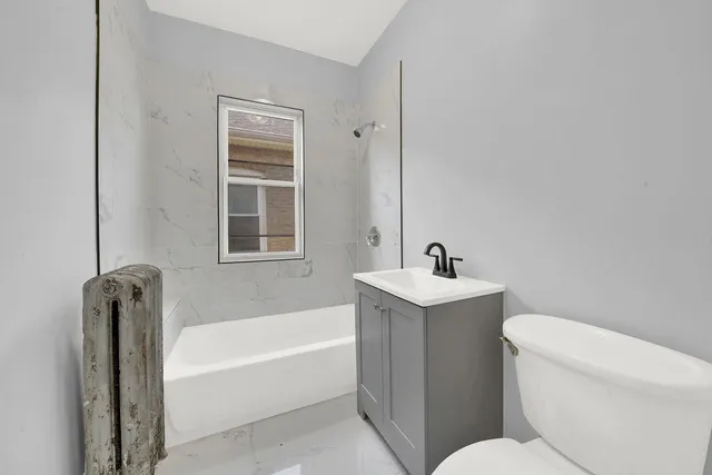 a bathroom with a sink toilet and bathtub